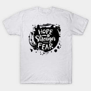 Hope is  stronger than fear. Lettering phrase. T-Shirt